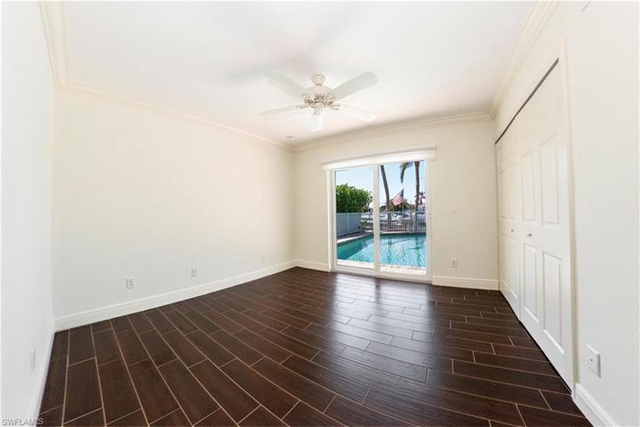 With hurricane glass sliders that lead to the pool area.