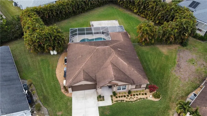 View of subject property with a pool