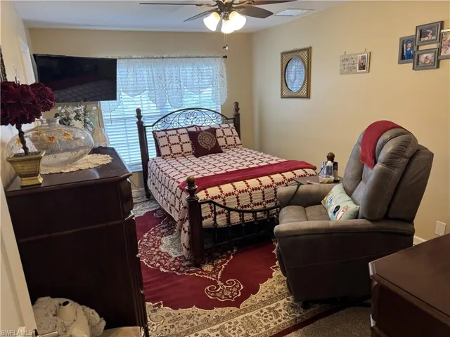 Bedroom featuring carpet and ceiling fan