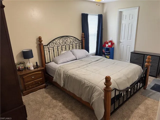 Bedroom featuring carpet
