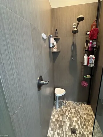 Full bathroom with a tile shower