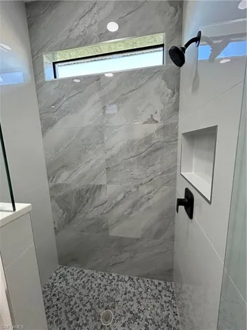 Bathroom with a tile shower