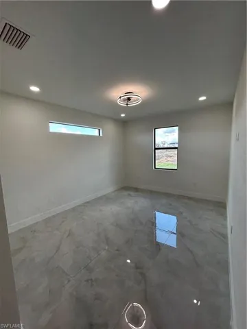 Spare room with recessed lighting