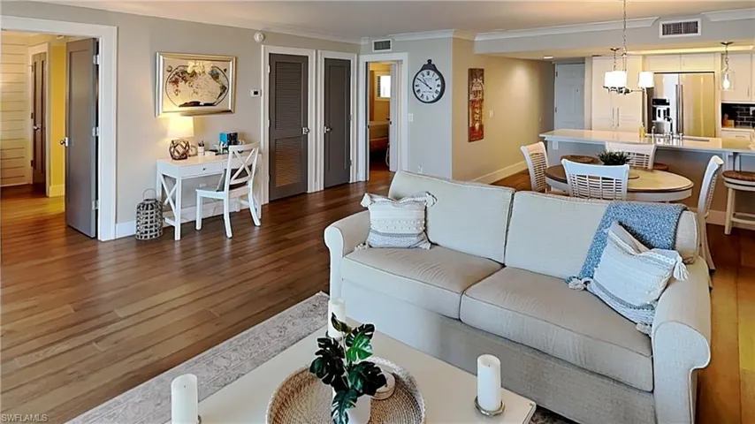 Open-concept living space with wood-finish flooring throughout