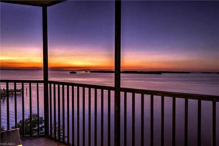 Balcony view overlooking open water and Sanibel Is