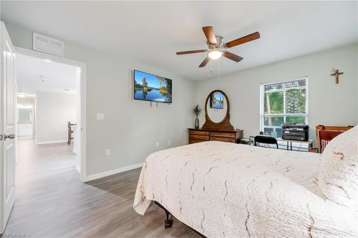 Bedroom featuring hardwood / wood-style floors and ceiling fan