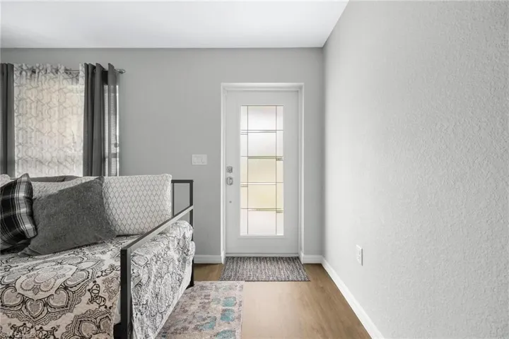 Entryway with hardwood / wood-style flooring