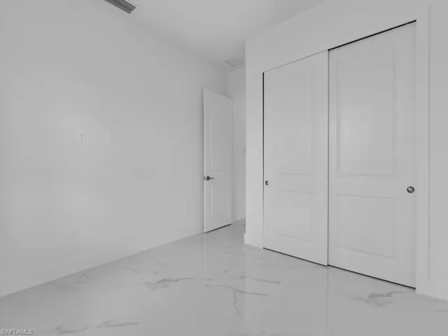 Unfurnished bedroom featuring a closet