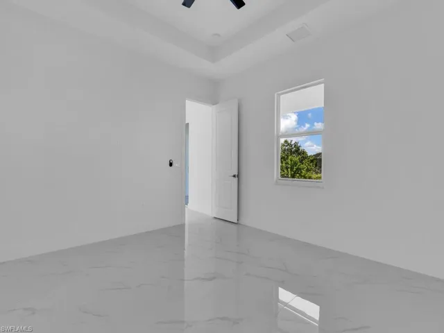 Spare room with a raised ceiling