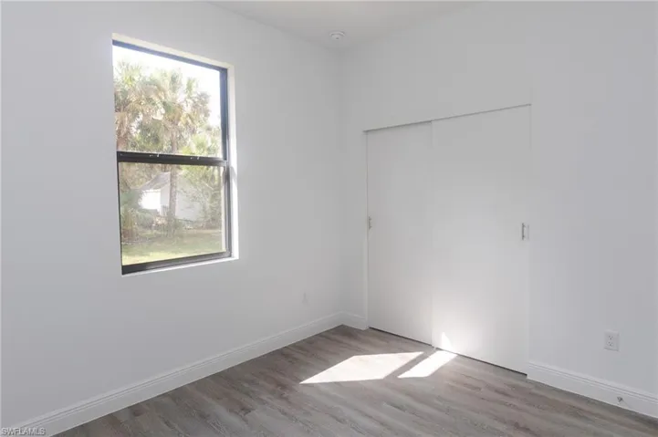Bedroom with vinyl floors.