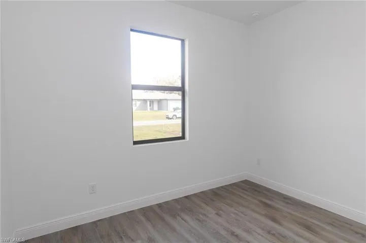 Bedroom with vinyl floors.