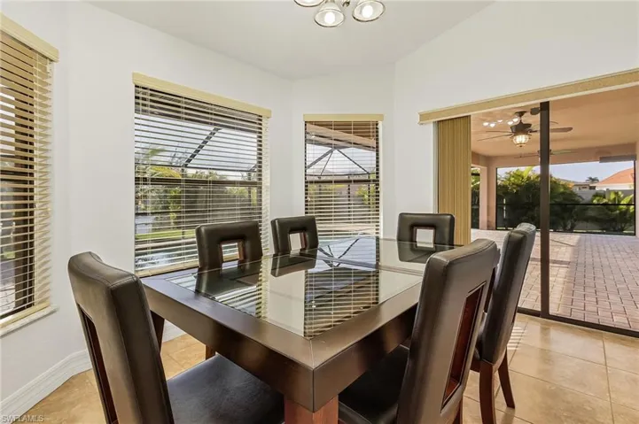 Dining area featuring a wealth of natural light and light tile patterned floors