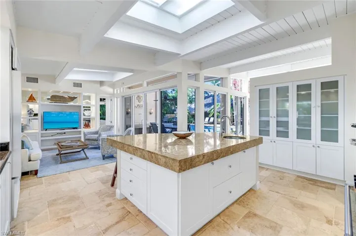 open to family room and outdoor dining area