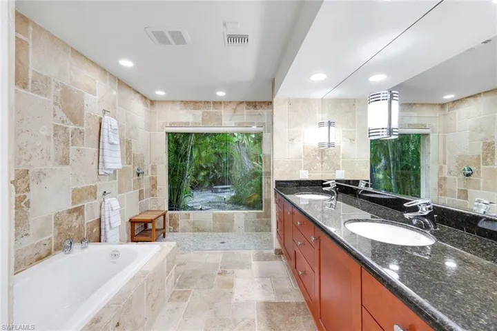 Bring the outdoors into the large private shower in the private primary bath.