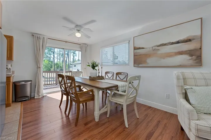 Dining space featuring ceiling fan and light wood-type flooring