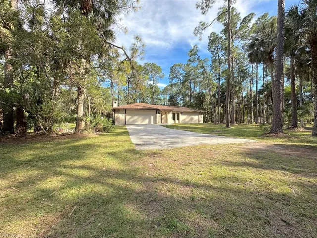 Wonderful 3 bedroom +den concrete block home close in to town and on 5 wonderful acres!