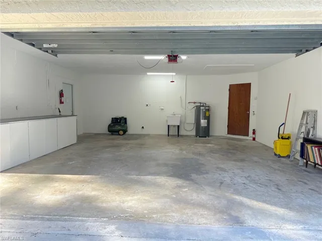 Gigantic oversized garage with laundry and 15' workbench! Has room for two cars and a large work shop.
