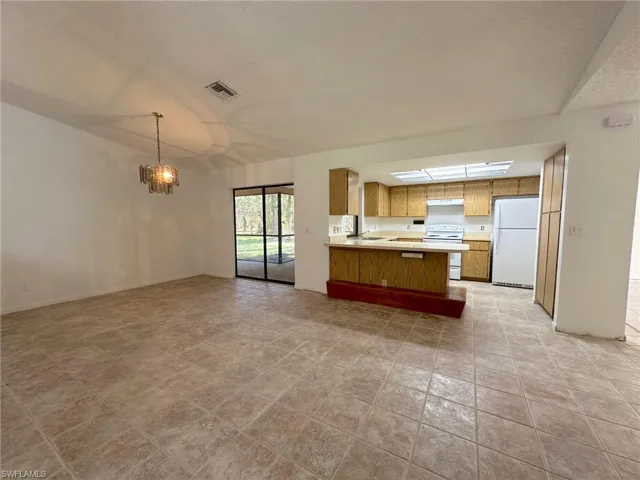 Sliders that open from kitchen and dining area.  And sliders pocket all to one side creating wide open space great for traffic flow and letting the outside in!