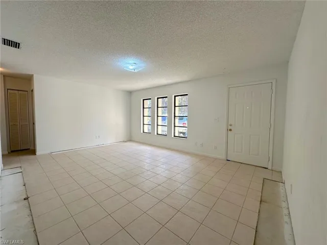 Large living room that could easily be converted in office, den, or even a fourth bedroom!