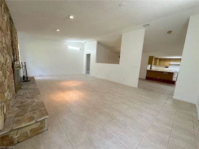 Looking back into dining room, kitchen and front living room.