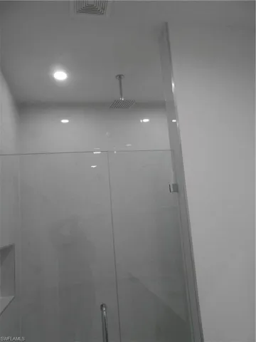 Bathroom view of a tile shower