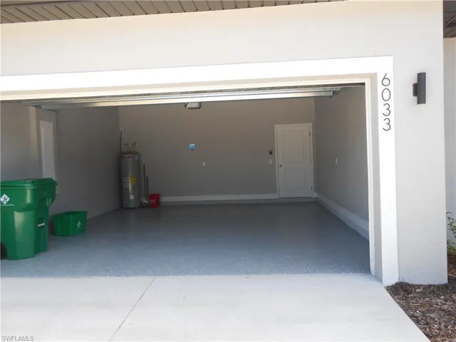 Garage featuring water heater