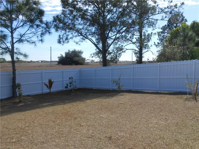 View of fenced backyard