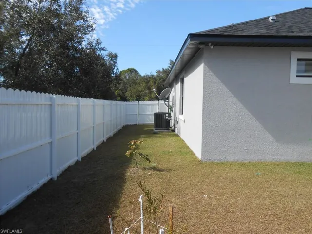 View of fenced backyard