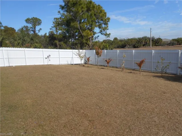 View of fenced backyard