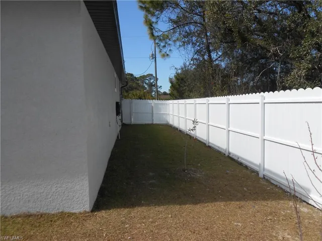 View of fenced backyard
