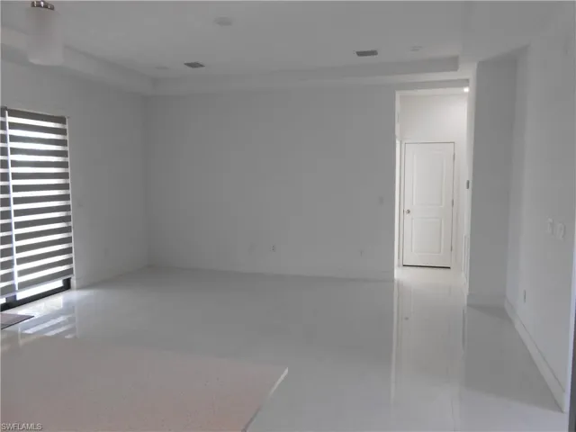 Spare room featuring baseboards