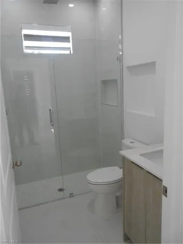 Full bath featuring toilet