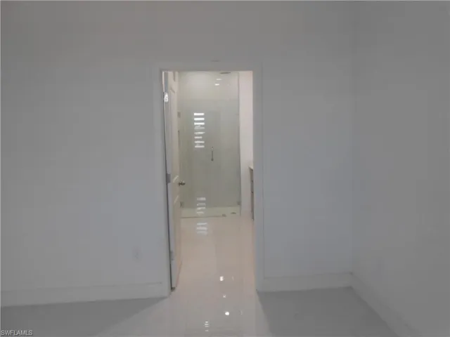 Hallway featuring baseboards
