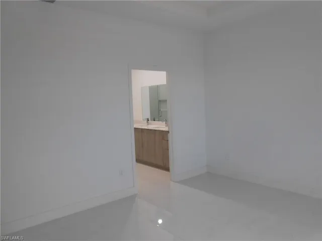 Spare room featuring baseboards