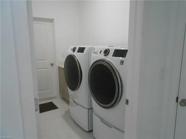 Laundry area featuring separate washer and dryer
