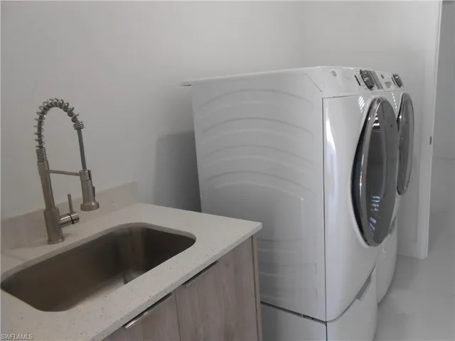 Laundry room with separate washer and dryer
