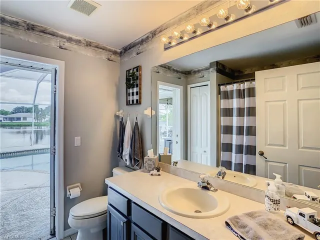 Bathroom with vanity and toilet