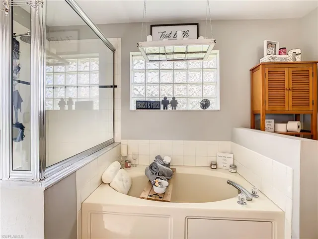 Bathroom featuring independent shower and bath