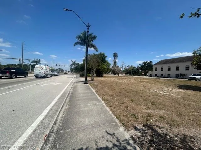 View of street featuring sidewalks and street lights