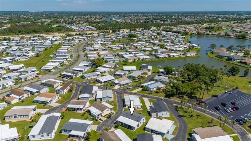 View of property location with a large body of water and nearby suburban area