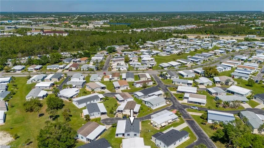 Aerial overview of property's location with nearby suburban area