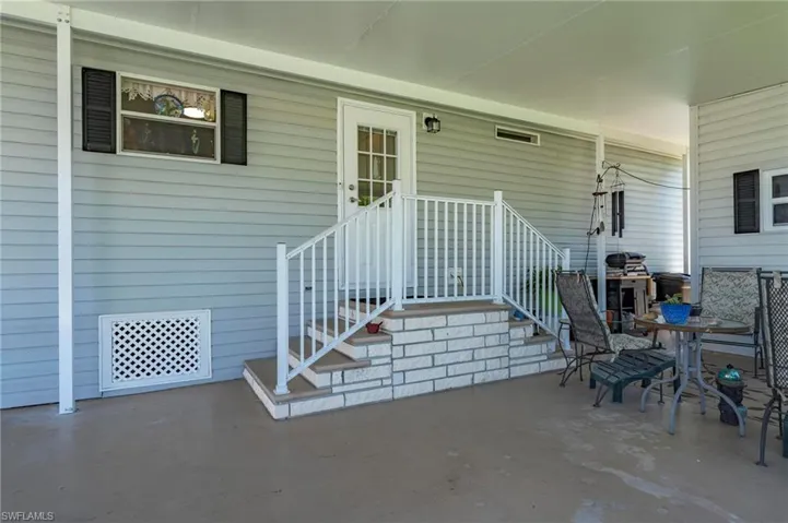 View of exterior entry featuring a patio area