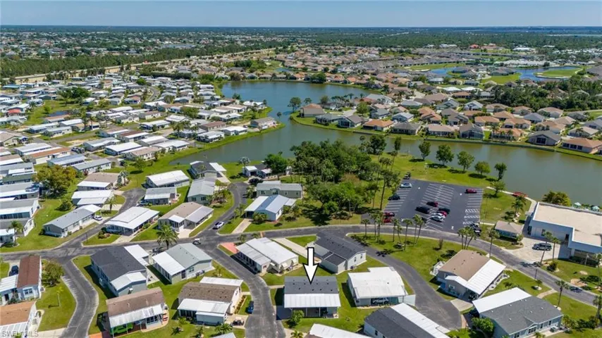 View of property location featuring nearby suburban area and a nearby body of water