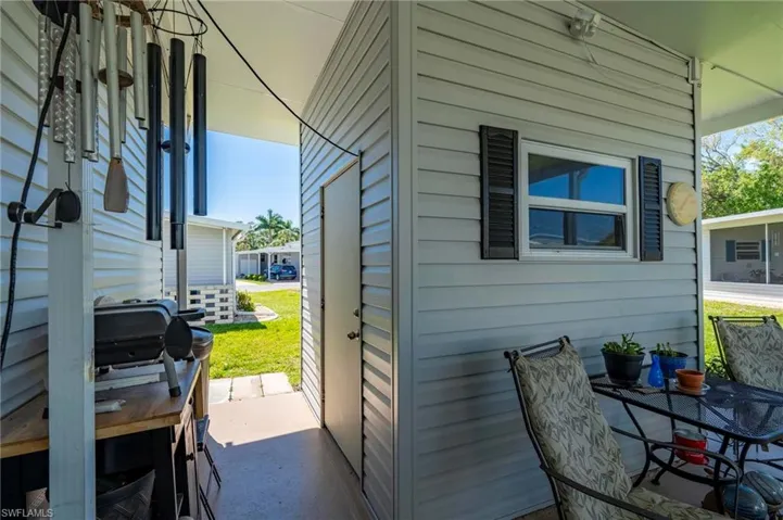 View of side of home featuring a patio