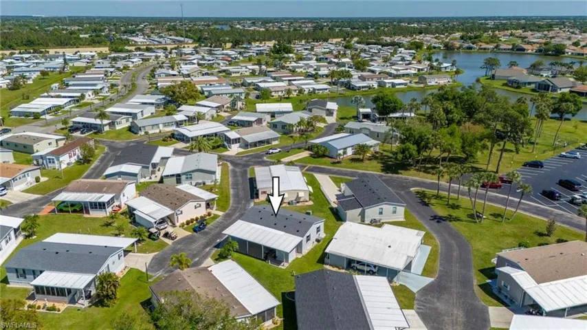 Aerial view of residential area featuring a large body of water