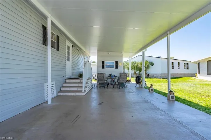 View of patio / terrace featuring a carport