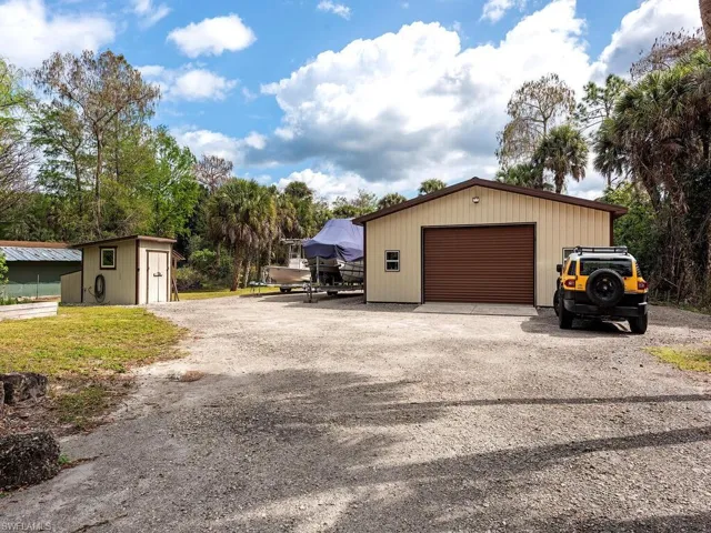 Detached garage with exterior electric and a large pad for boats/RV/work vehicles