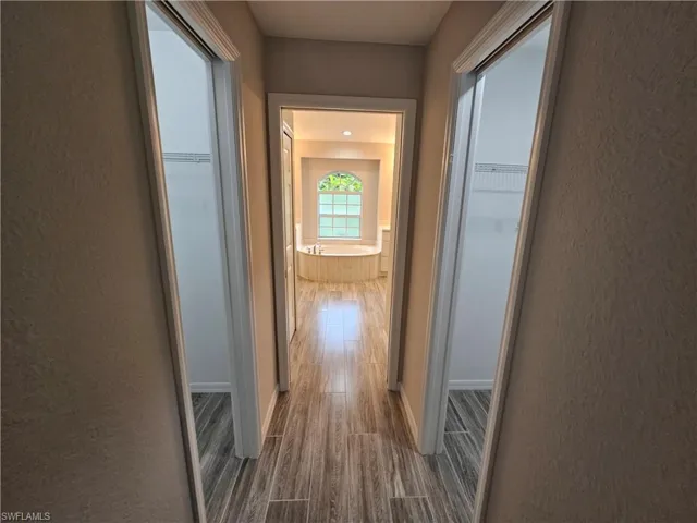 Hall with wood-type flooring