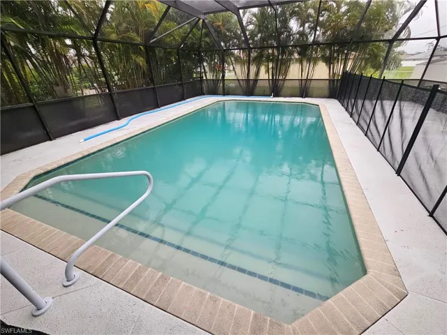 View of pool with a lanai