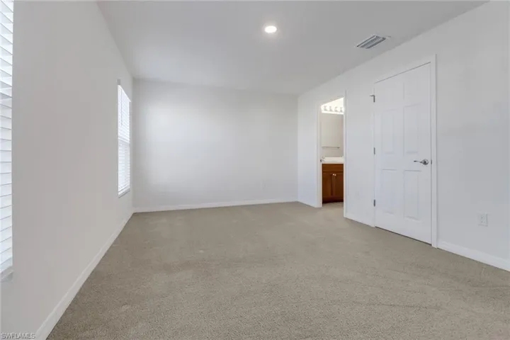 Bedroomroom featuring light carpet